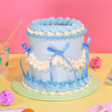 Vintage Cake - Tonal Colour by Crumbs & Doilies with blue Swiss Meringue buttercream and ribbon decorations